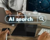 AI search Chat Digital marketing image shows person using digital pen to interact with computer screen displaying words AI search and search icons